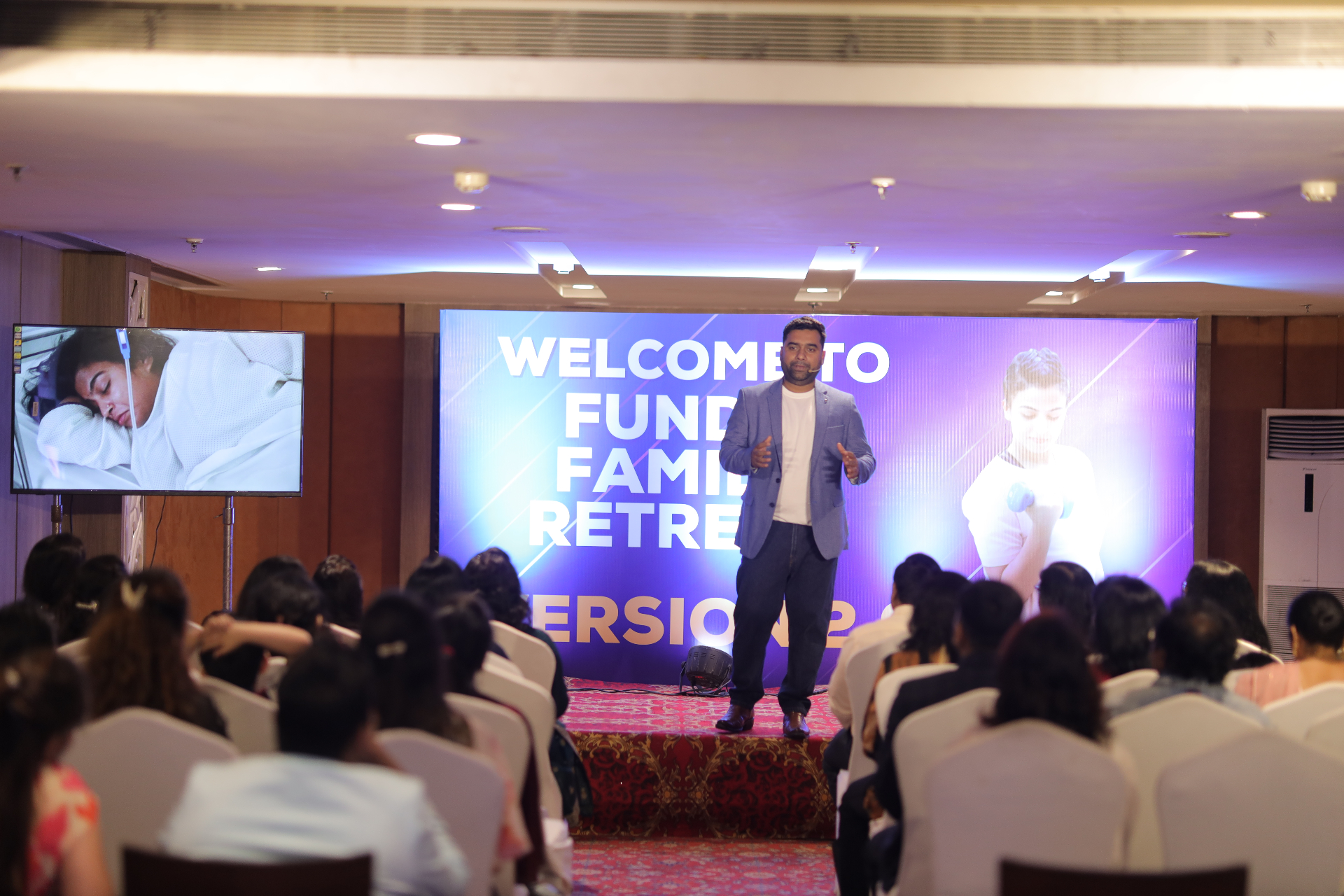 Ujjwal Abhishek speaking on stage at Funda Family Retreat
